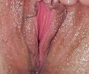 Spanish milf with tremendous clit touches herself and puts her fingers in her big meaty and juicy pussy