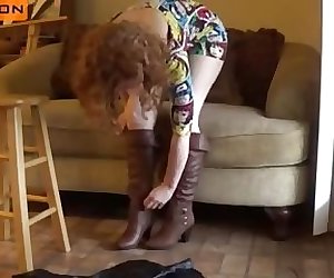Sexy redhead MILF in tight minidress tryes sexy boots ! enjoy her big ass !